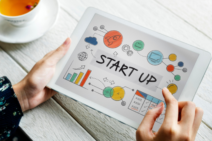 Startup founder preparing business account documents and financial checklist